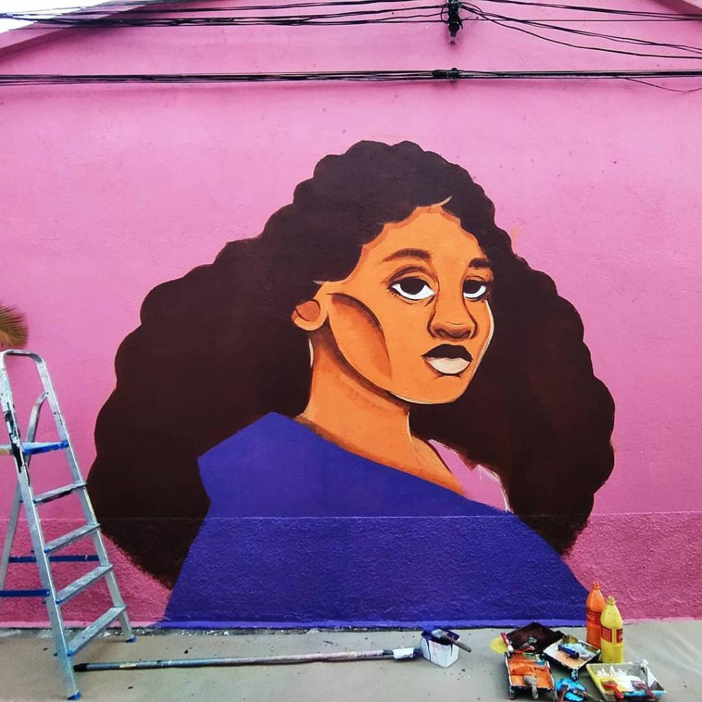 muro pintado por ziza de uma mulher